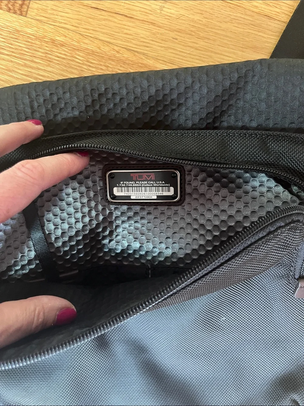 Tumi Black Messenger Bag with Brown Accents